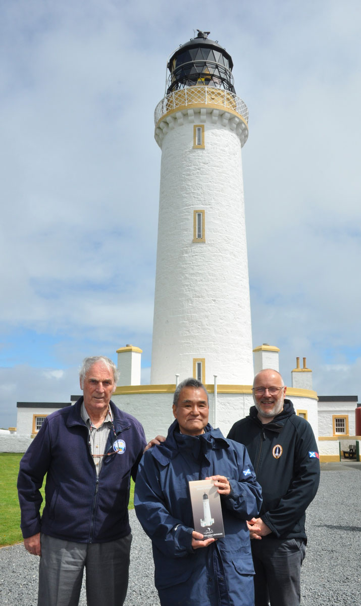 Hideki Noguchi, Alex Peebles and Philip Day in front of the Mull of Galloway Lighthouse